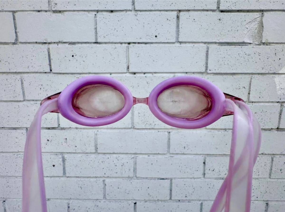 Swim goggles kept clear with FOG OFF!