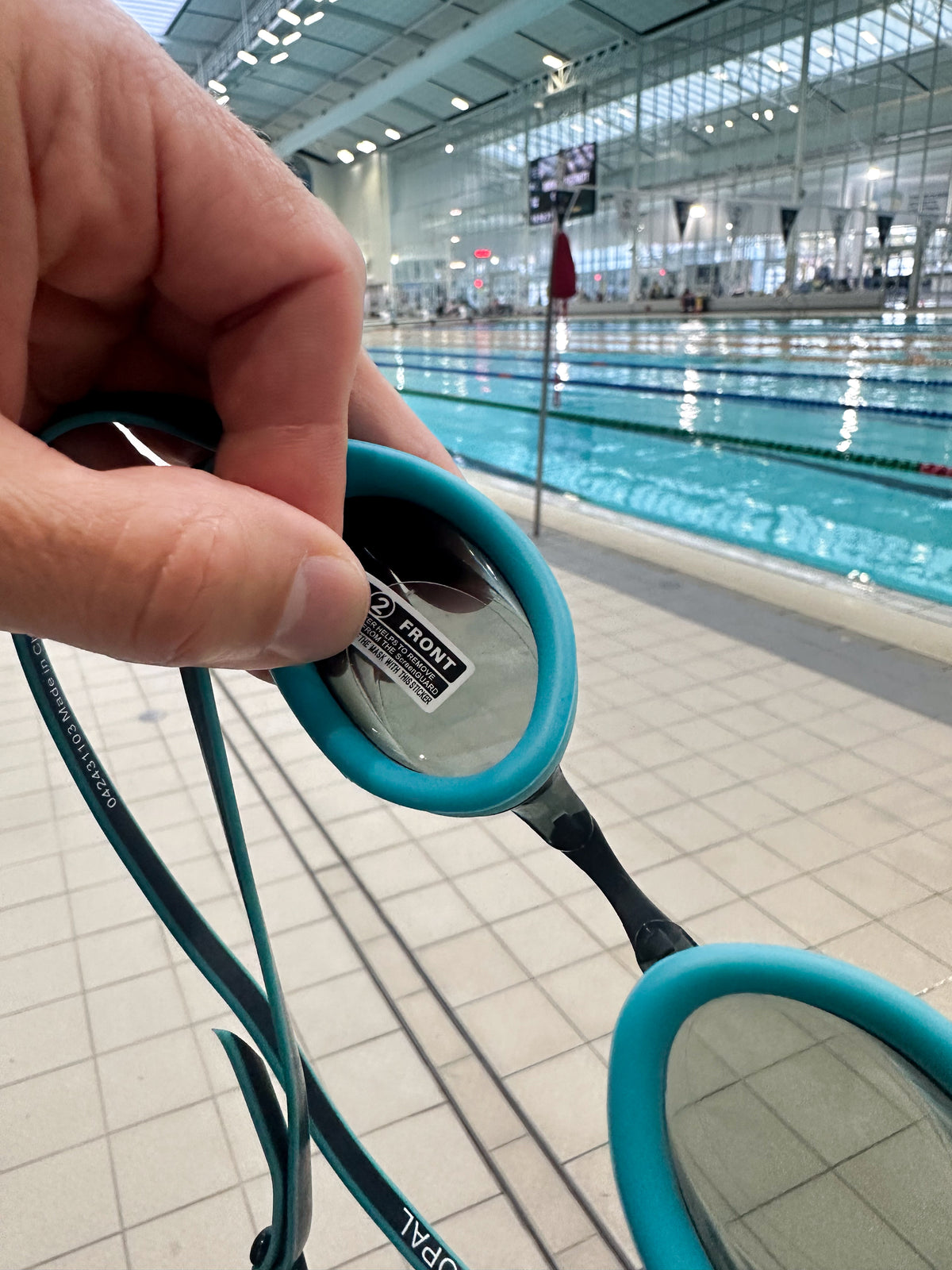 FOG OFF! patch inside a swim goggle lens, poolside